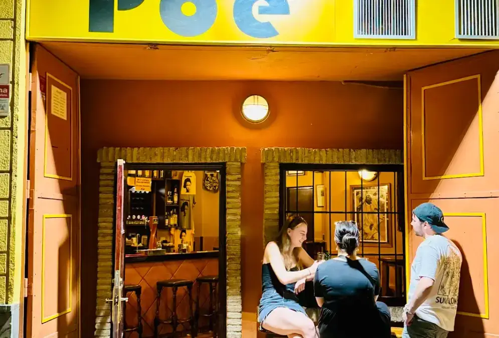 Interior of Bar Poë Granada with modern bar counter and drinks