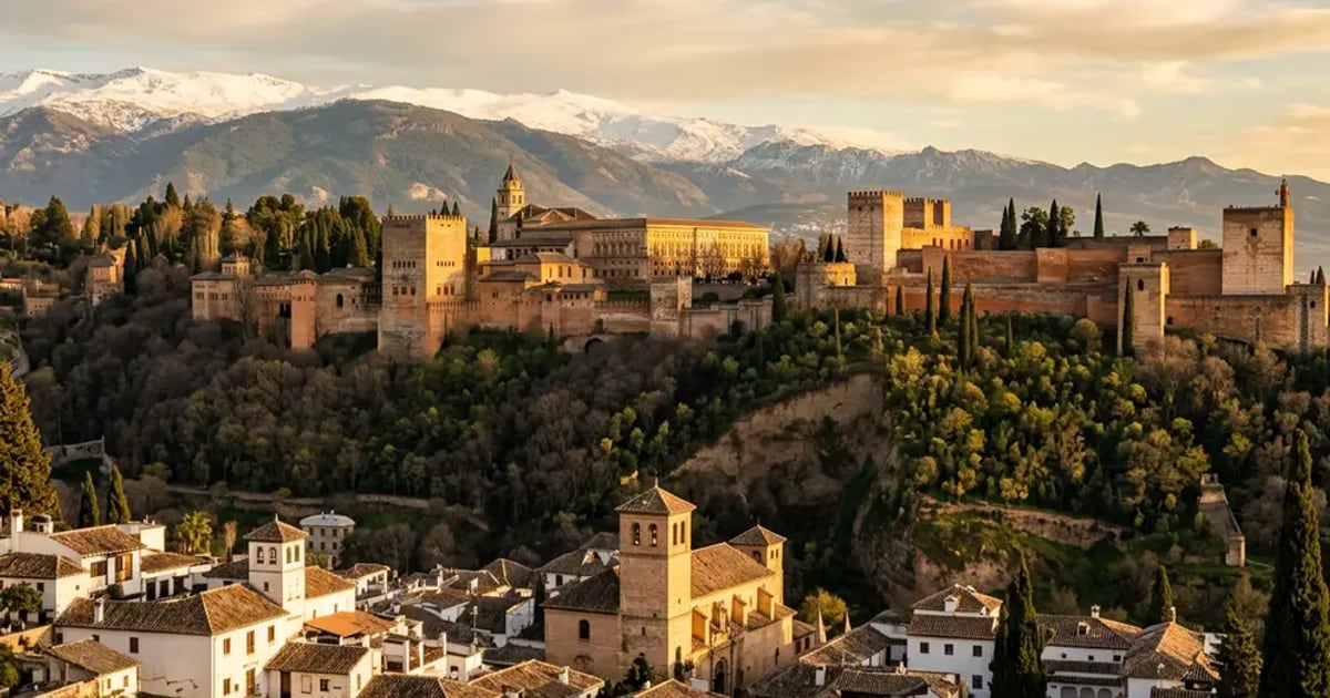 The Nasrid Palaces at the Alhambra, Granada, with intricate geometric stucco and arched doorways